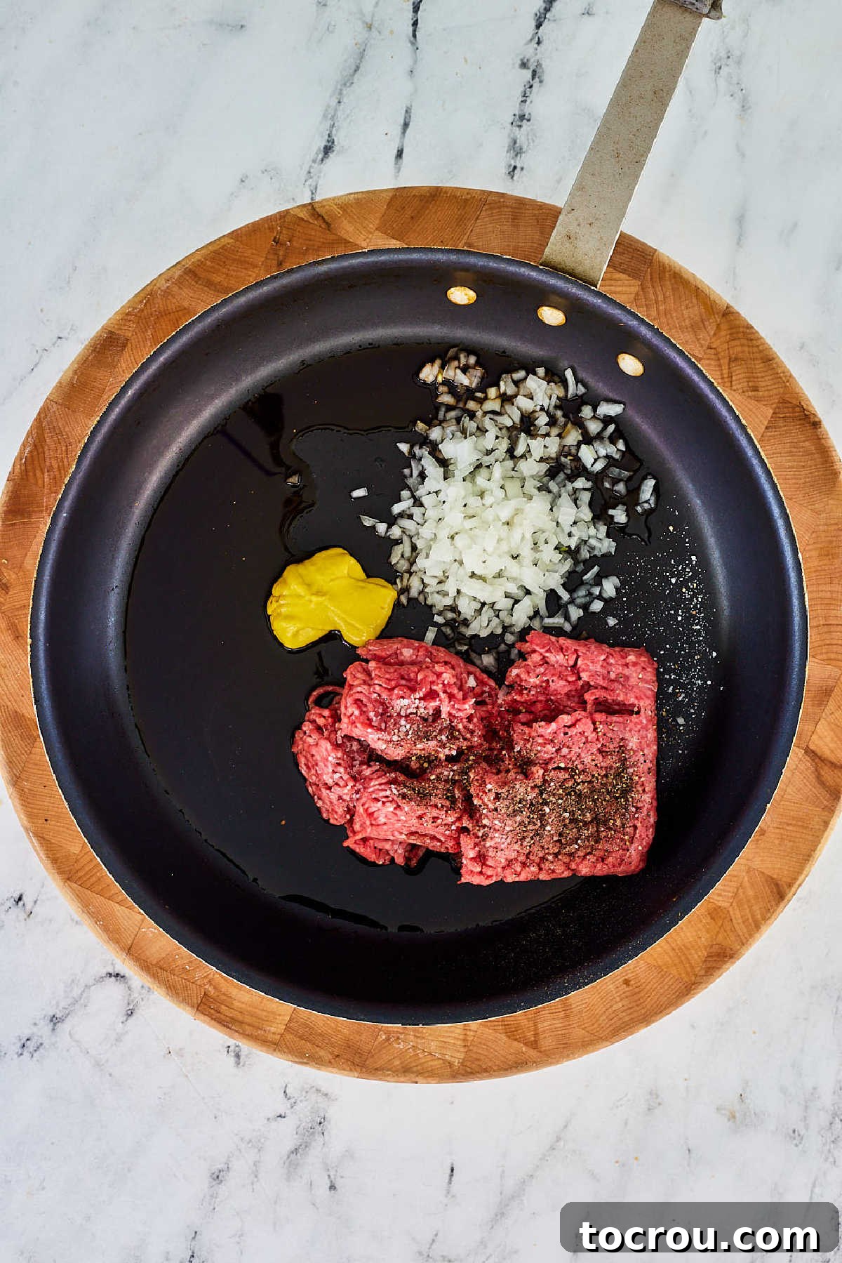 Maidrite ingredients in skillet, ready to be cooked.