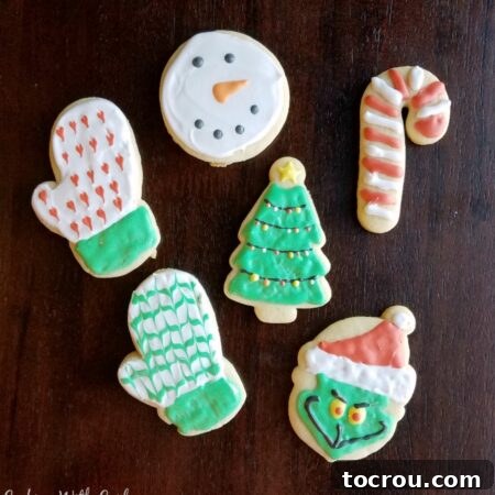 Go to sugar cookies cut into christmas shapes and decorated like mittens, the Grinch, a candy cane, snowman and Christmas trees with royal icing.