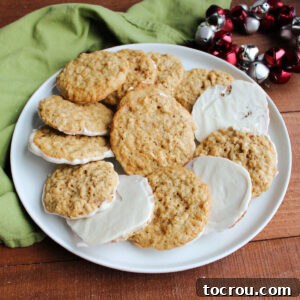 Plate of frostbite cookies with cornflakes, oatmeal and more with white chocolate on the bottom of the cookies.