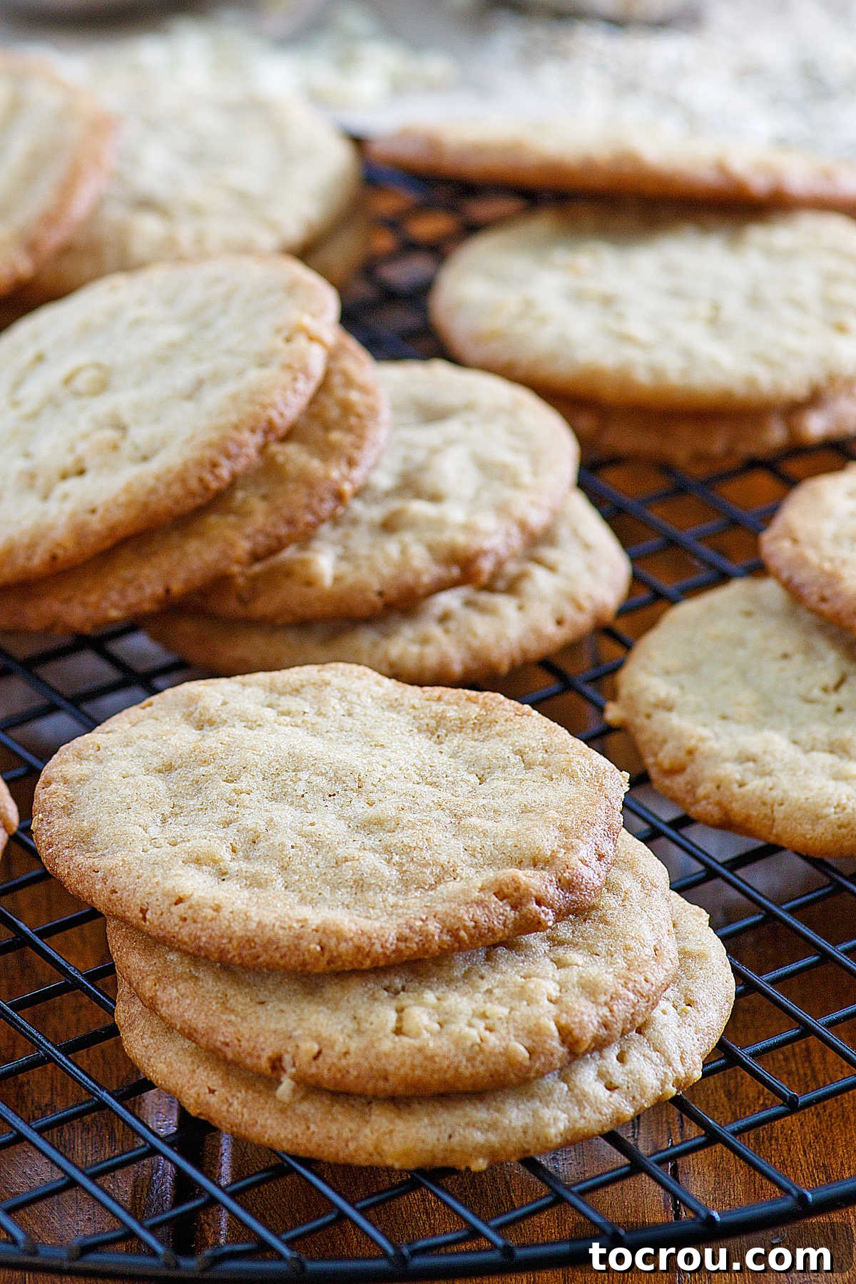 stacks of 7 cup cookies on wire cooling rack.