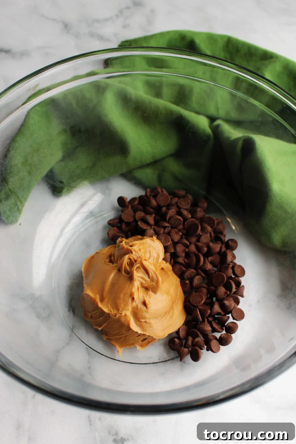 Peanut Butter and Chocolate Chips Bowl with peanut butter and chocolate chips inside, ready to be melted.