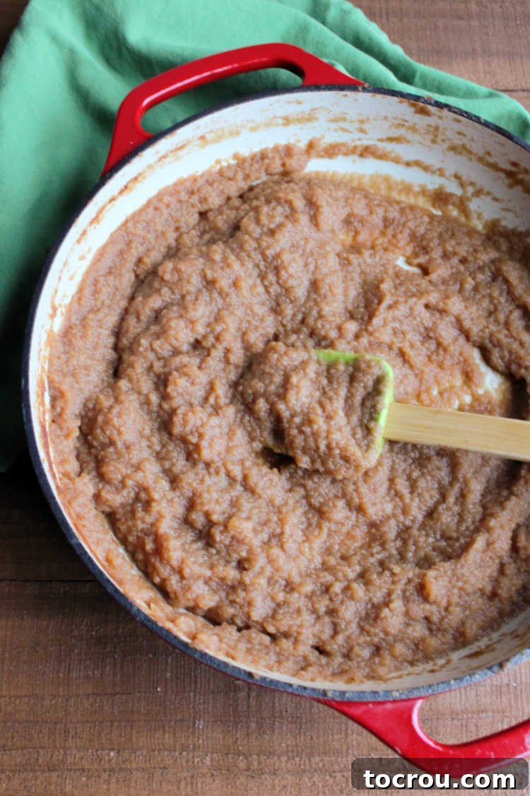 Finished Apple Butter in Pan pan full of freshly cooked deep brown apple butter.