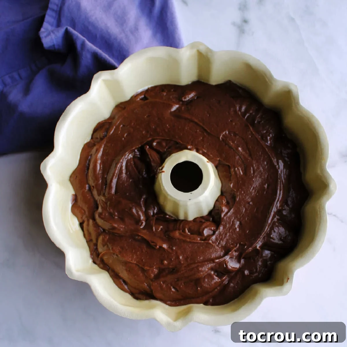 Chocolate cake batter in bundt pan.