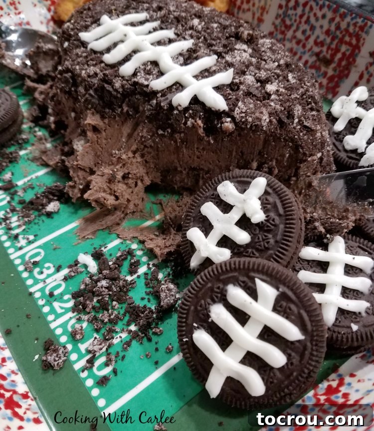 Football decorated Oreos with chocolate cheese ball and dippers.
