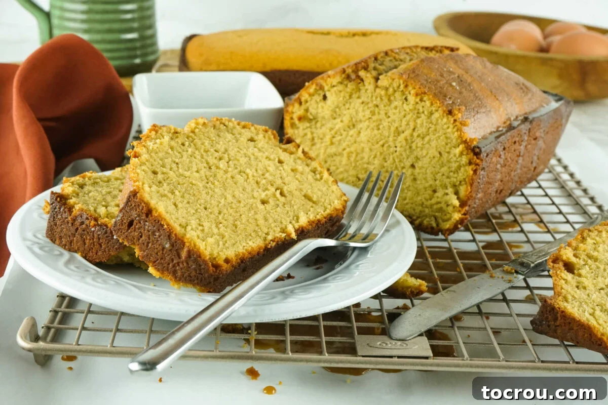 Espresso Pound Cake 2 Slices of loaf shaped coffee flavored pound cake on plate with fork.