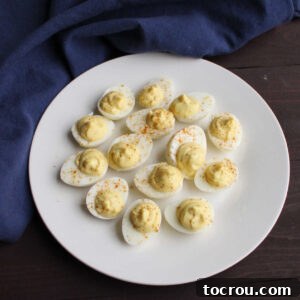 Plate filled with mini quail deviled eggs, showcasing their delightful appearance and perfect presentation.