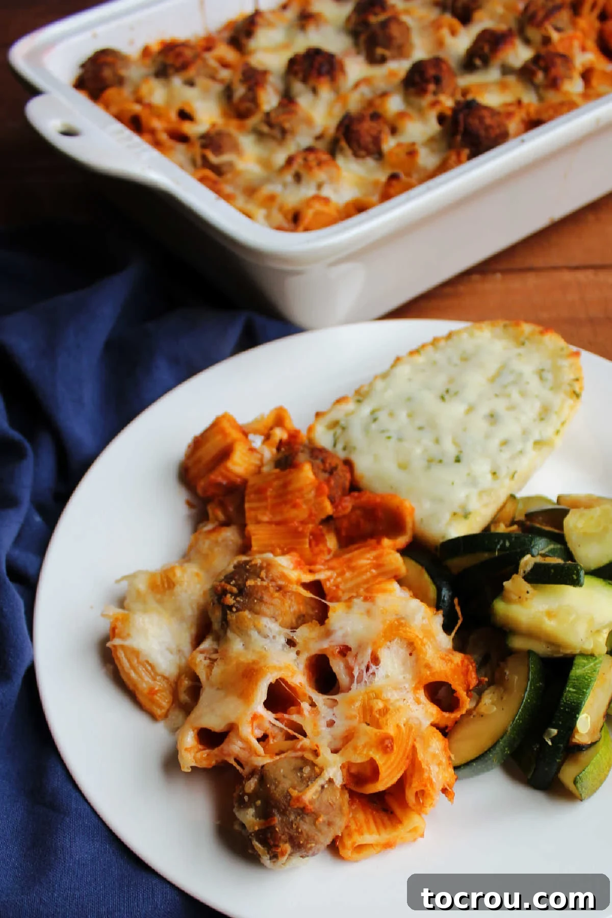Close up of baked rigatoni and meatballs.