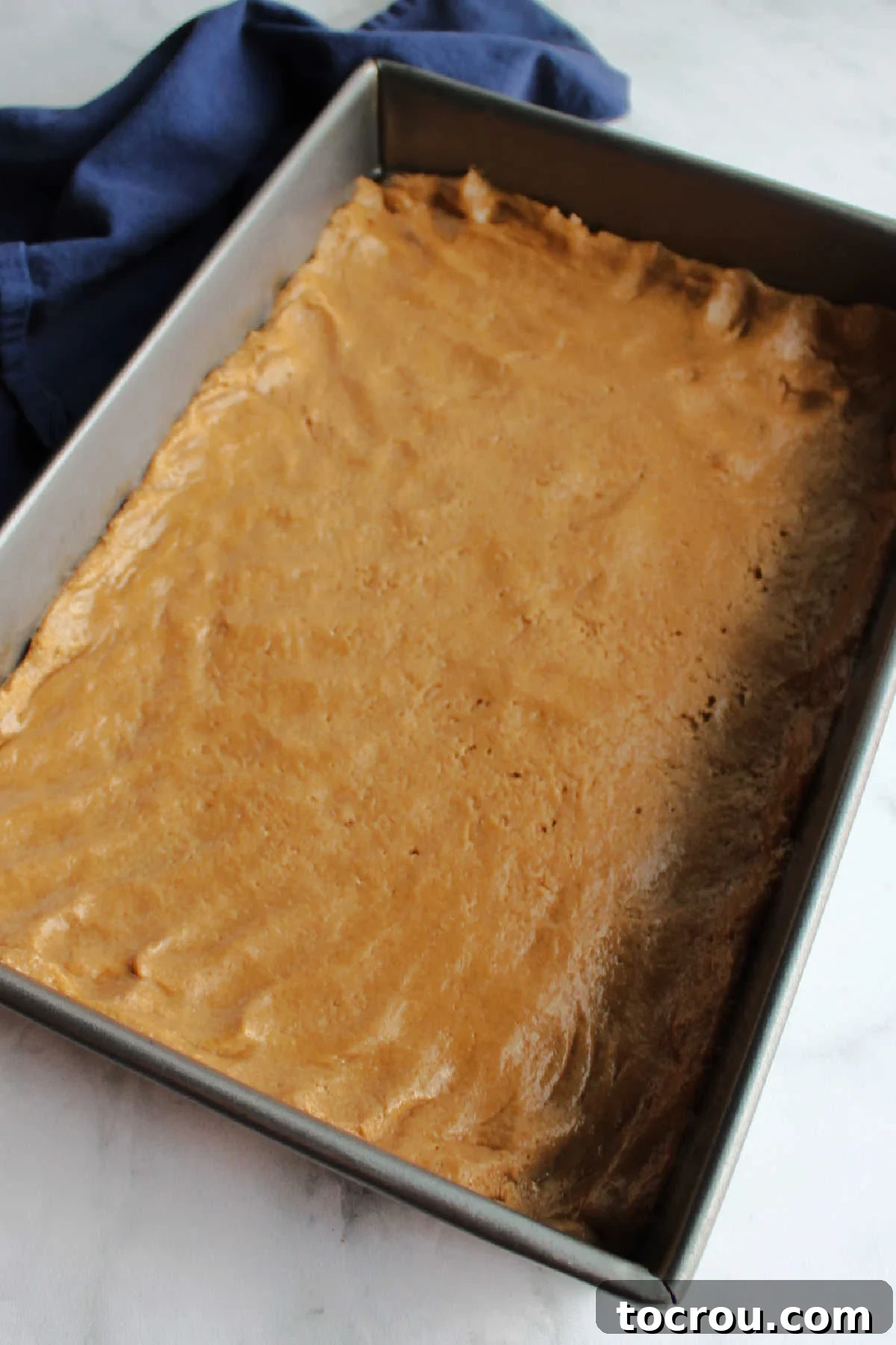 Spiced Cake Crust The spiced cake crust mixture, perfectly patted into the bottom of a baking pan, ready for the creamy apple butter filling.