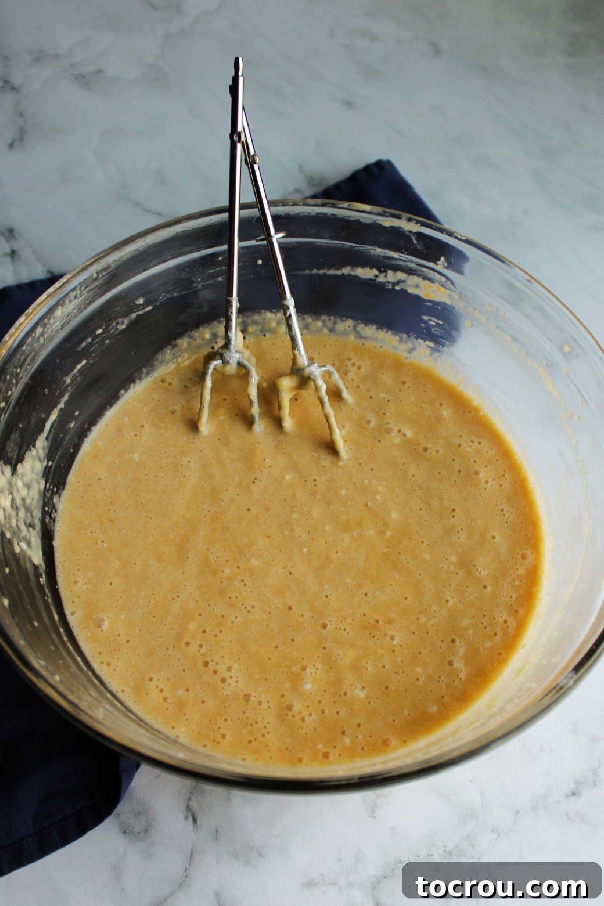 Cream Cheese Apple Butter Filling A bowl filled with the luscious cream cheese and apple butter mixture, prepared to be poured evenly over the cake crust.
