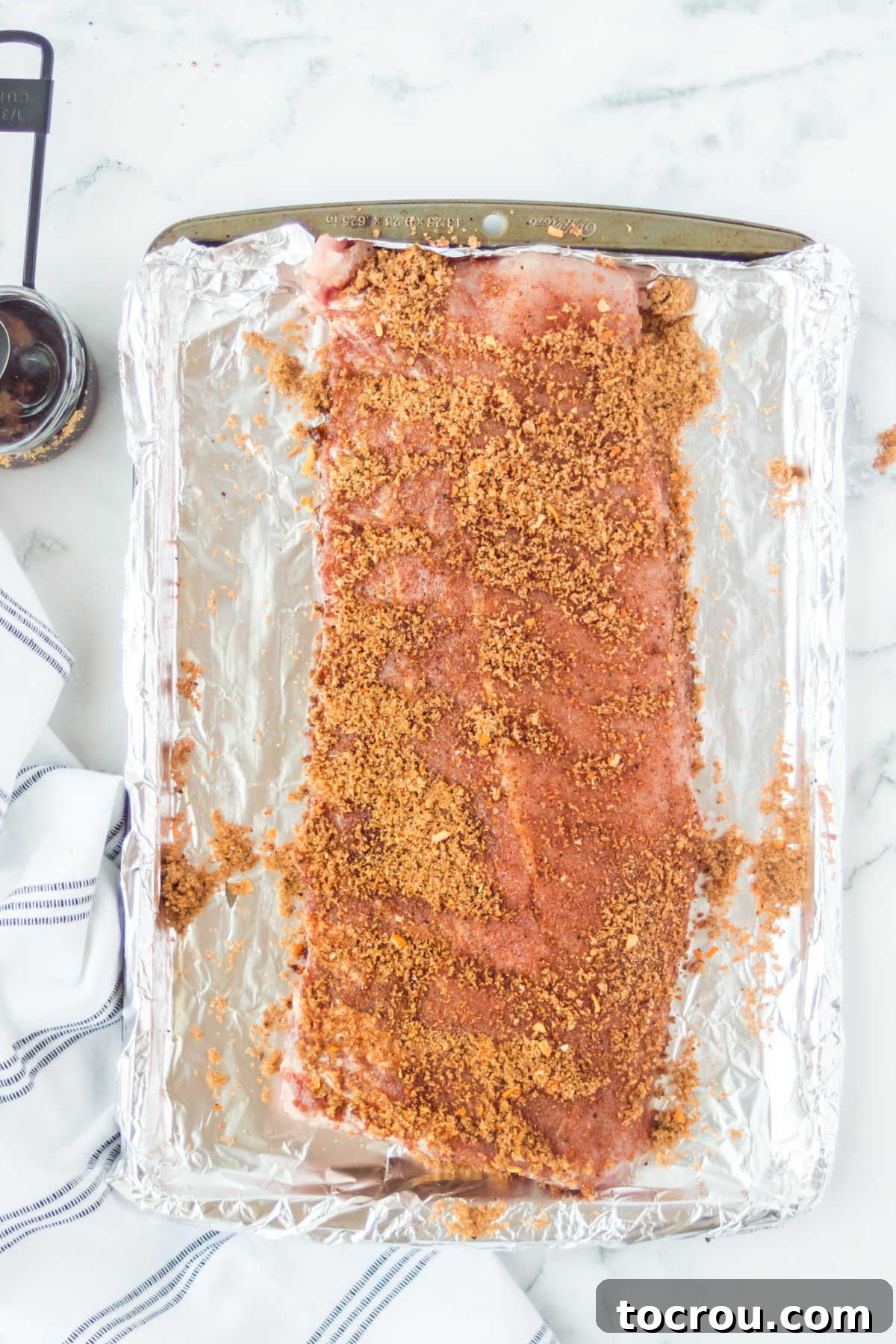 Mouthwatering Oven Baked Ribs 4 Rack of ribs coated in seasoning rub ready to cook