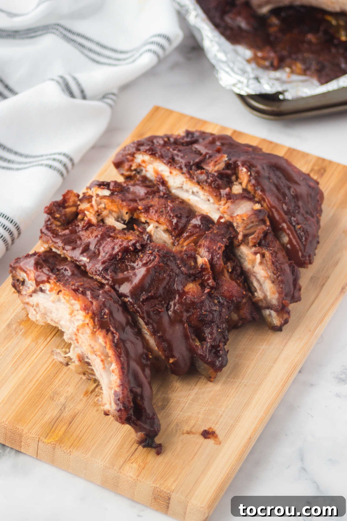 Mouthwatering Oven Baked Ribs 8 Ribs cut into individual bones, ready to serve.
