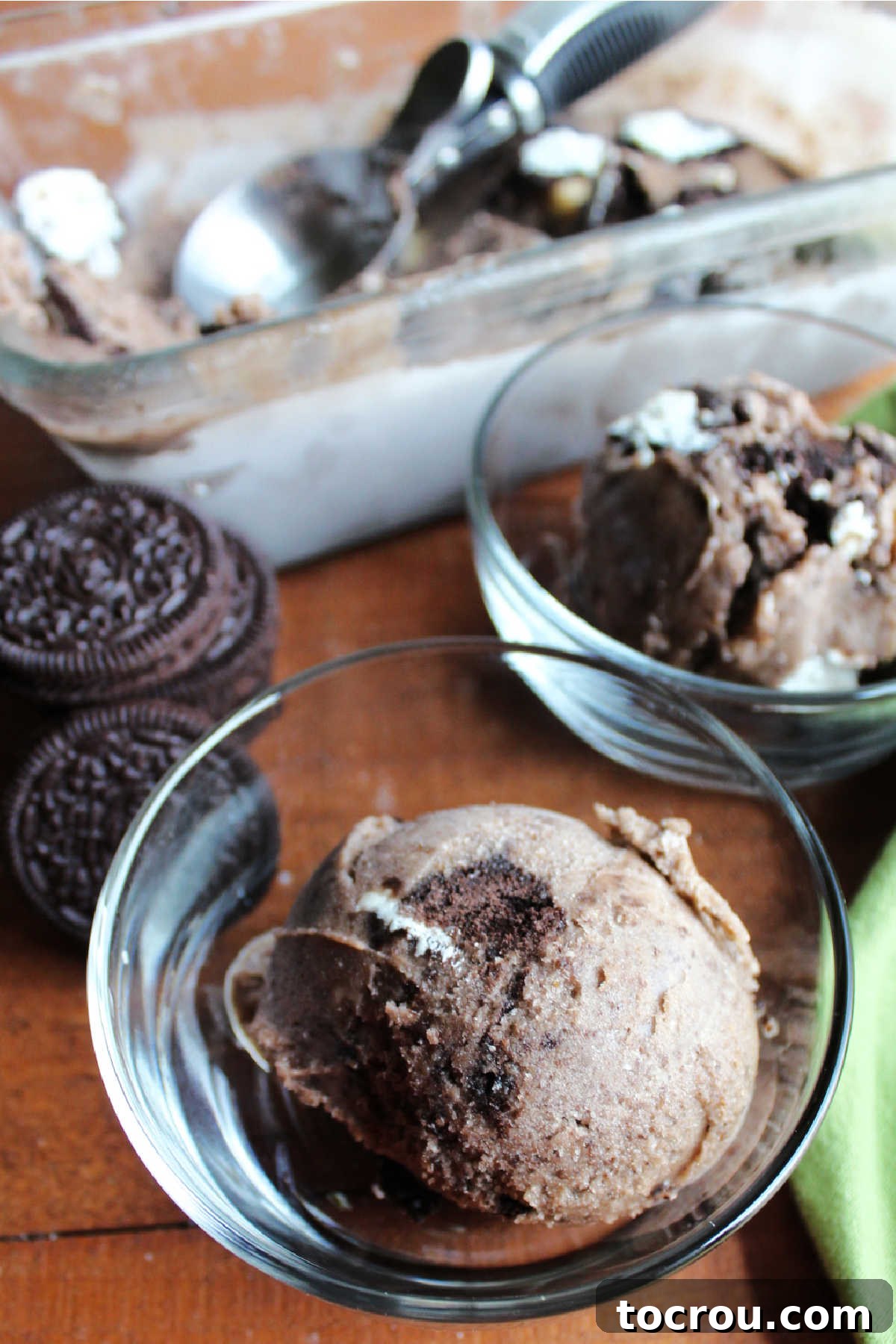 Small glass bowls filled with Oreo banana nice cream ready to eat.