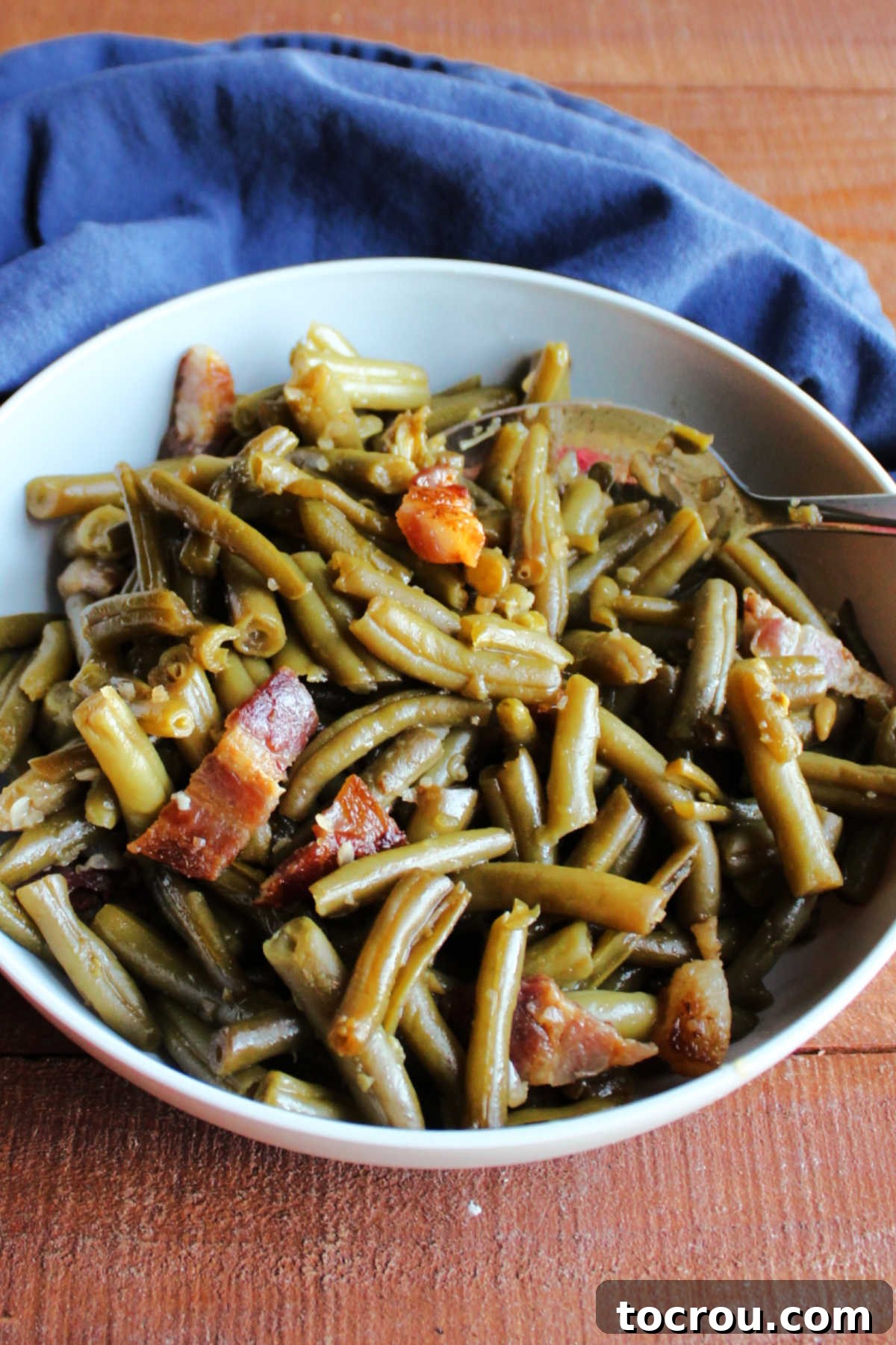 Homestyle Slow Cooker Smothered Green Beans 5 Close bowl filled with sweet and sour green beans.