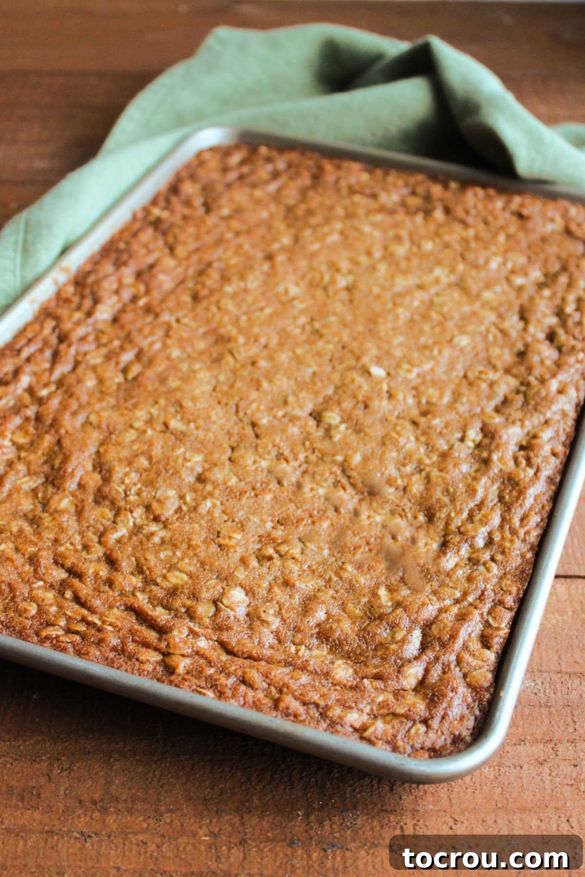 Pan of baked oatmeal cookie bars fresh from the oven.