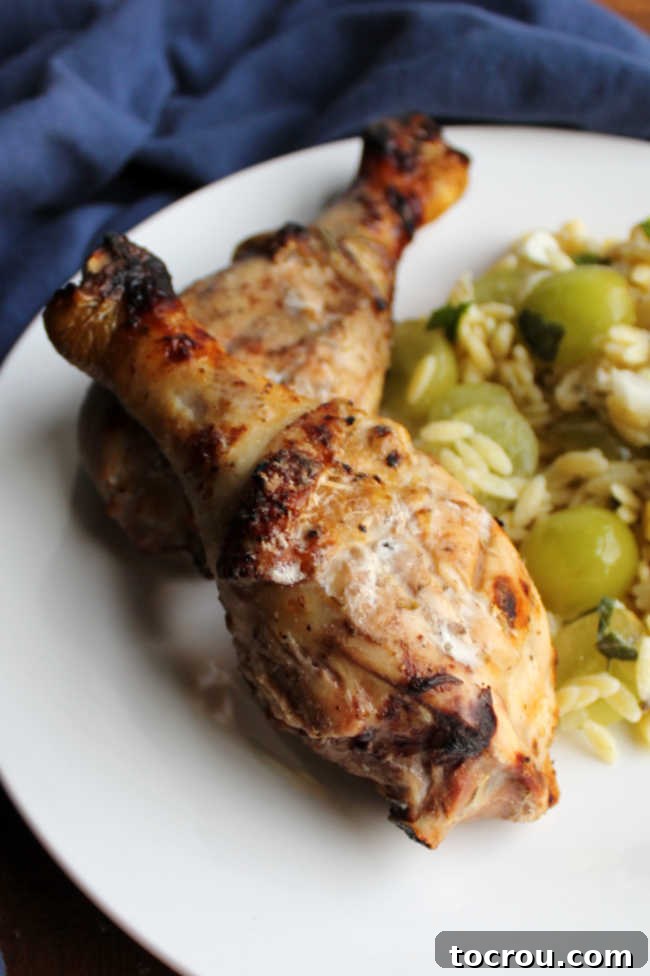 Deliciously Grilled Chicken Drumsticks Close-up of perfectly grilled, juicy chicken drumsticks with a golden-brown, slightly crispy skin, ready to be served.