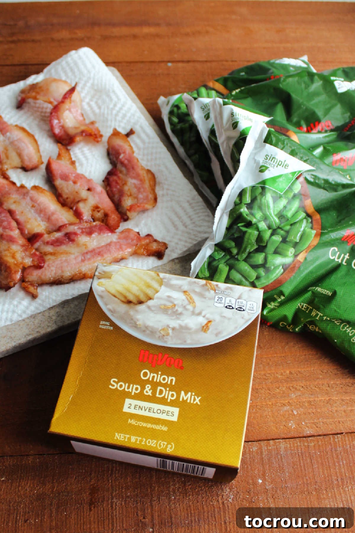 Savory green bean ingredients, bacon, green beans and onion soup mix ready to be combined.