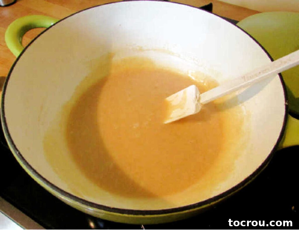 Nutty Brown Butter Glaze 4 saucepan of thick, rich brown butter glaze ready to be drizzled over cake