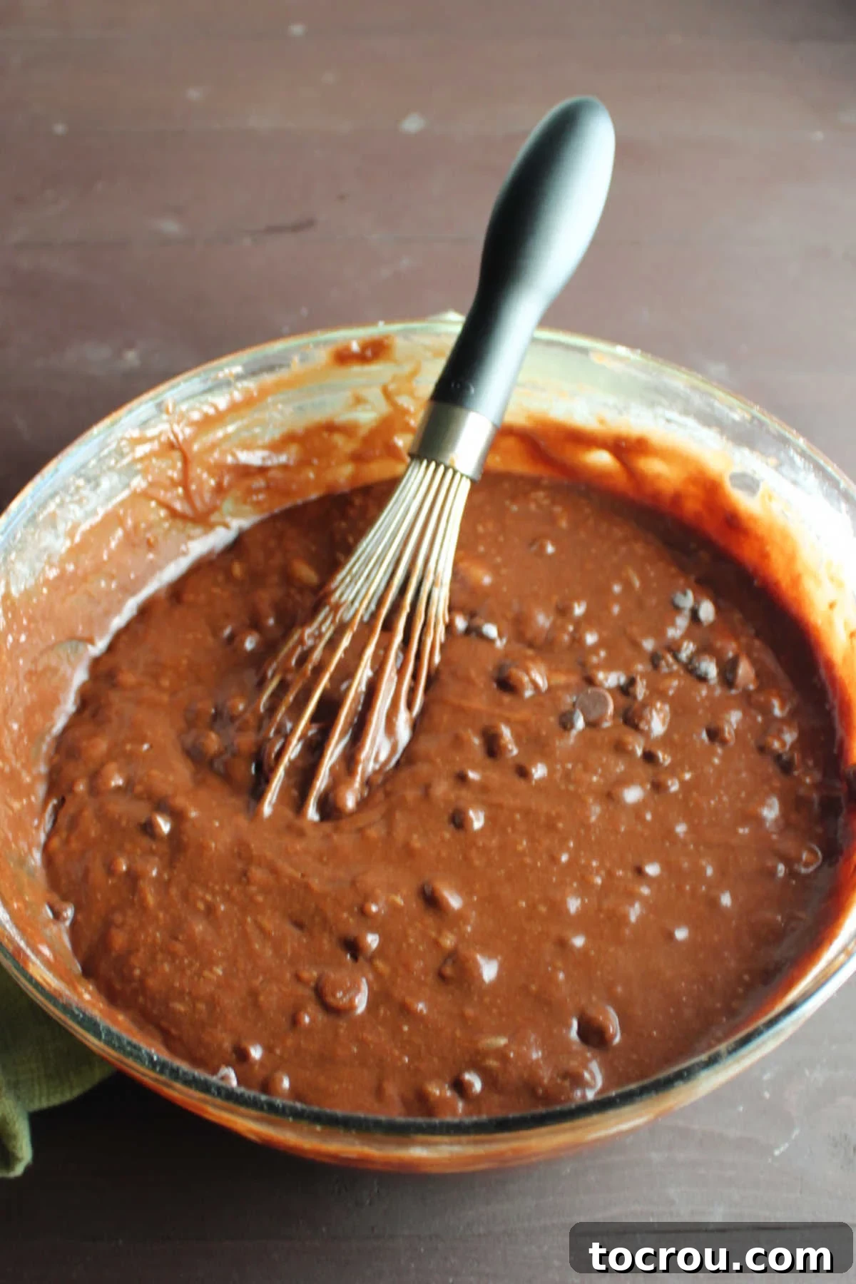 Rich Brownie Batter Big mixing bowl of chocolate brownie batter with chocolate chips inside, ready to go in pan.