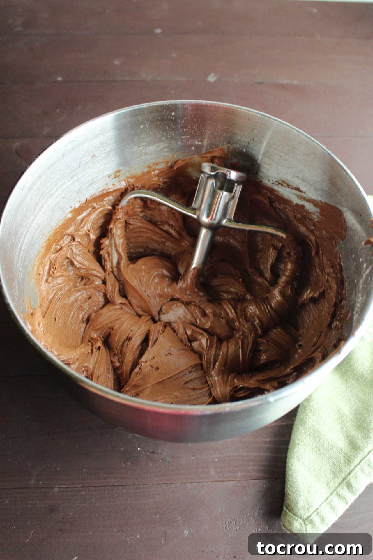 Smooth Chocolate Frosting Batter Mixer bowl of chocolate frosting ready to go on brownies.