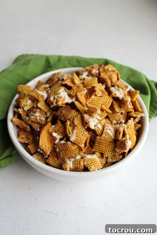 Grab a handful of this sweet apple pie inspired snack mix and dig in. This is a quick and recipe that is fun for so many occasions.