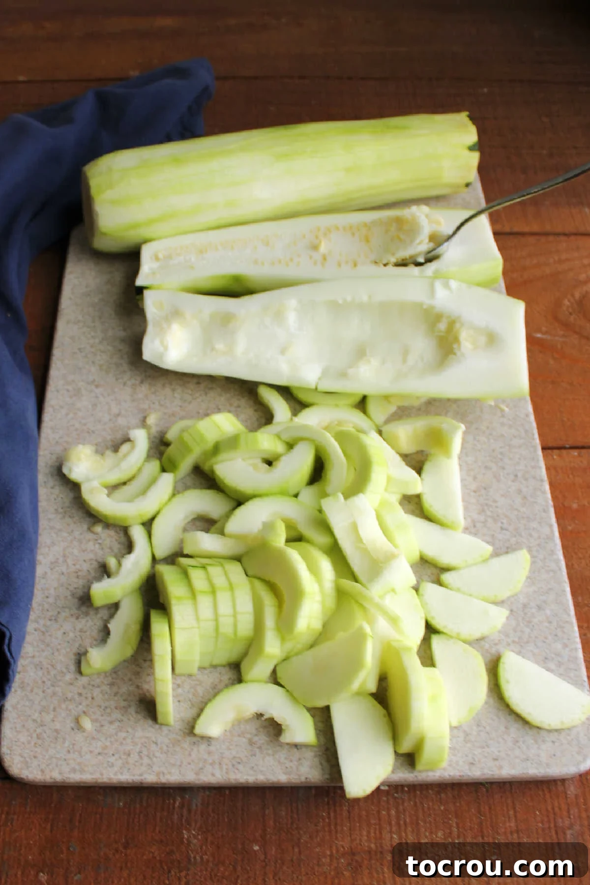 Preparing zucchini for the mock apple pie by carefully peeling the skin, removing seeds, and slicing thinly to resemble apple wedges.