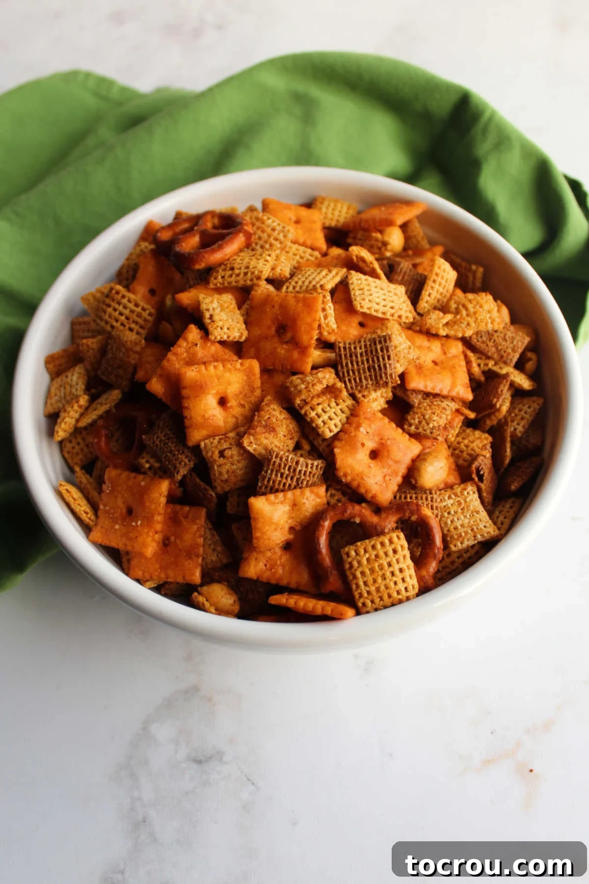 Bowl of chex mix made with taco seasoning, cheese crackers etc. ready to eat.
