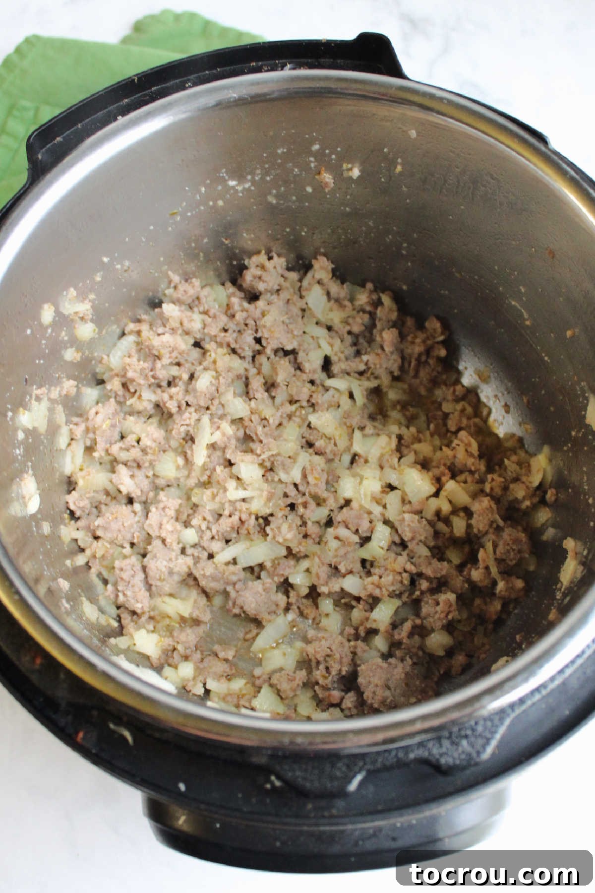 Browned Italian sausage and onions in instant pot.