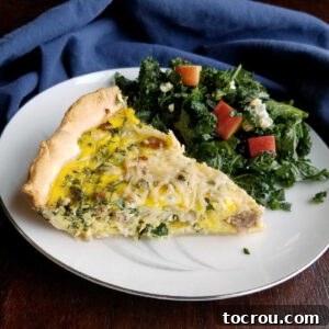 A perfectly baked Sausage and Kale Quiche, sliced and ready to enjoy, showcasing its hearty ingredients and golden crust.
