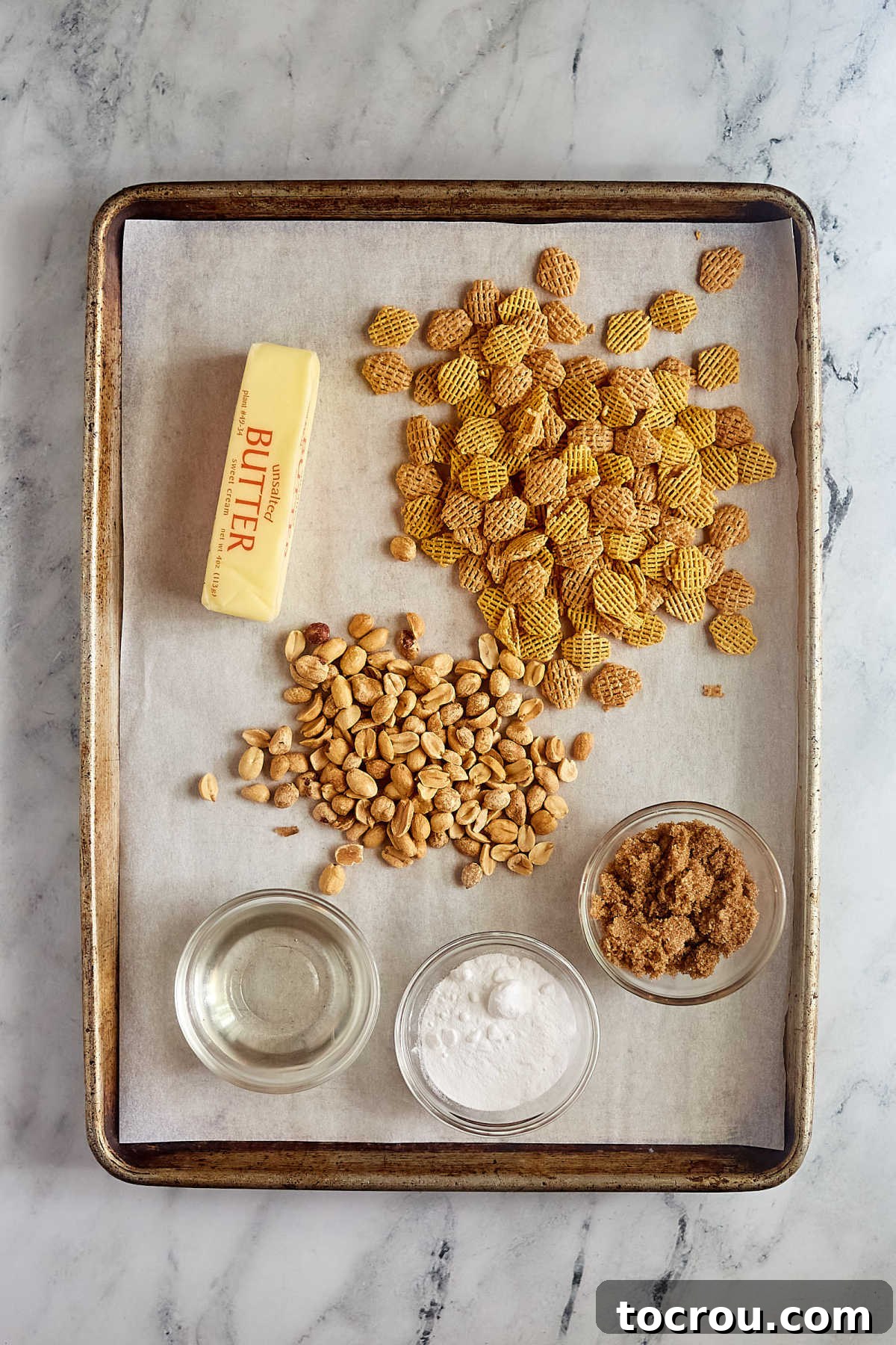 Caramel Crispix Ingredients Ingredients including Crispix cereal, peanuts, butter, brown sugar, corn syrup, and baking soda, ready to be made into caramel Crispix snack mix. Essential components for a delicious homemade caramel snack.