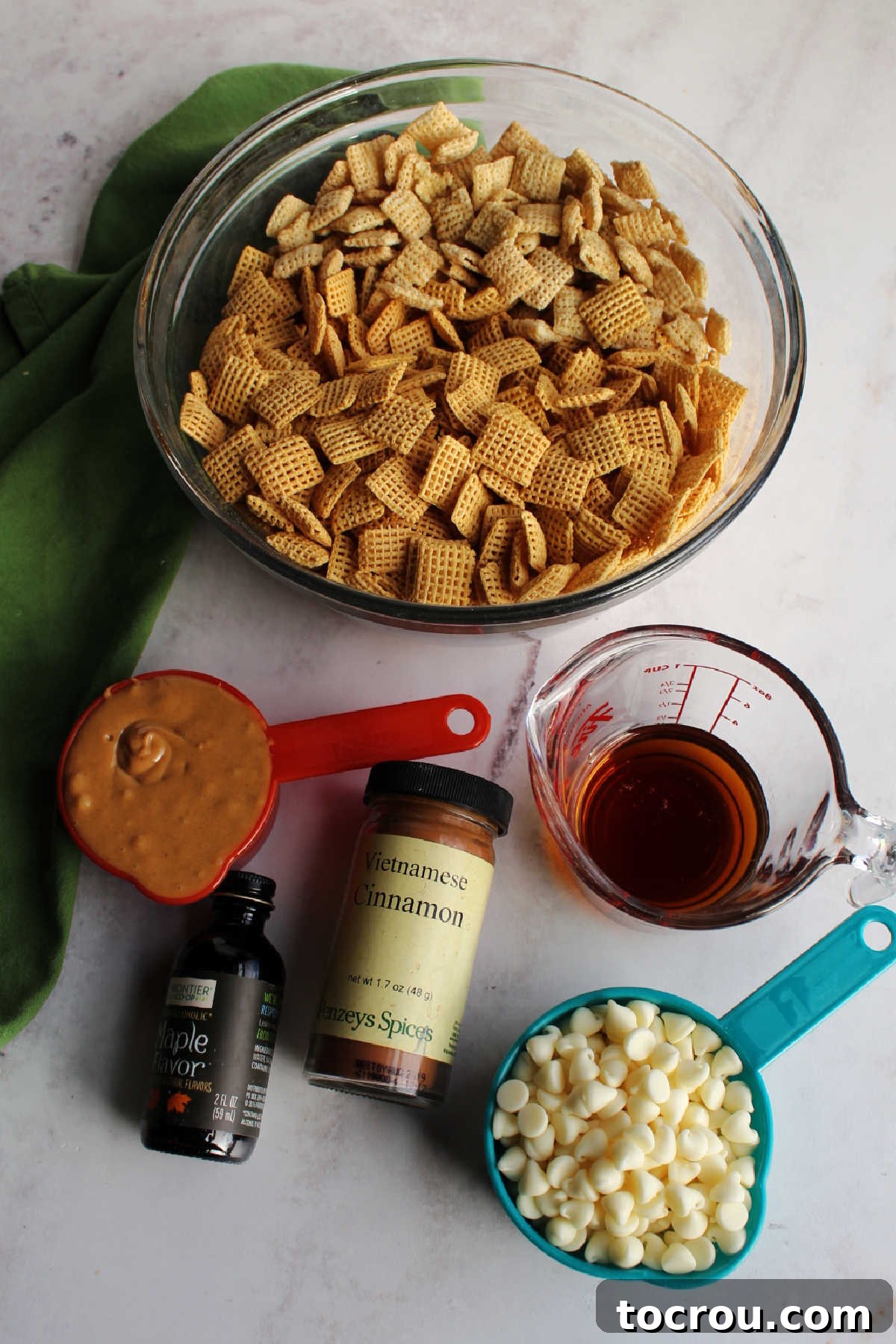 Bowls of ingredients ready to be made into maple cinnamon french toast puppy chow.