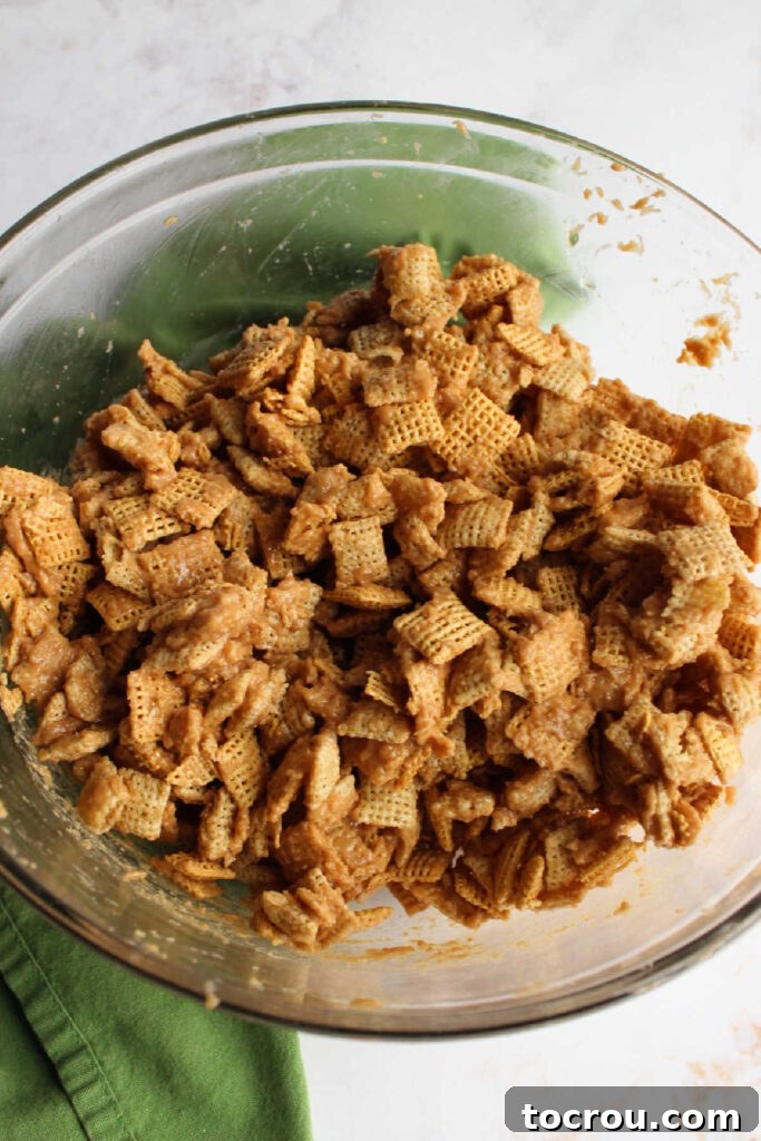 Bowl of Chex cereal coated in maple cinnamon peanut butter mixture.