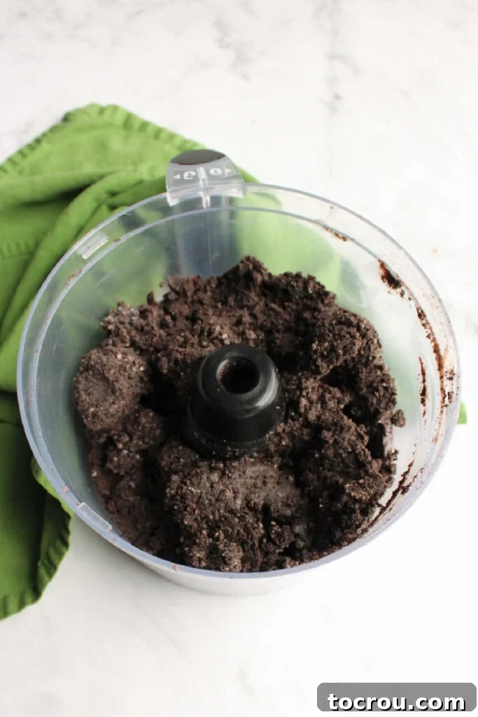 Creamy No-Bake Oreo Truffles 4 Oreo ball mixture in food processor.