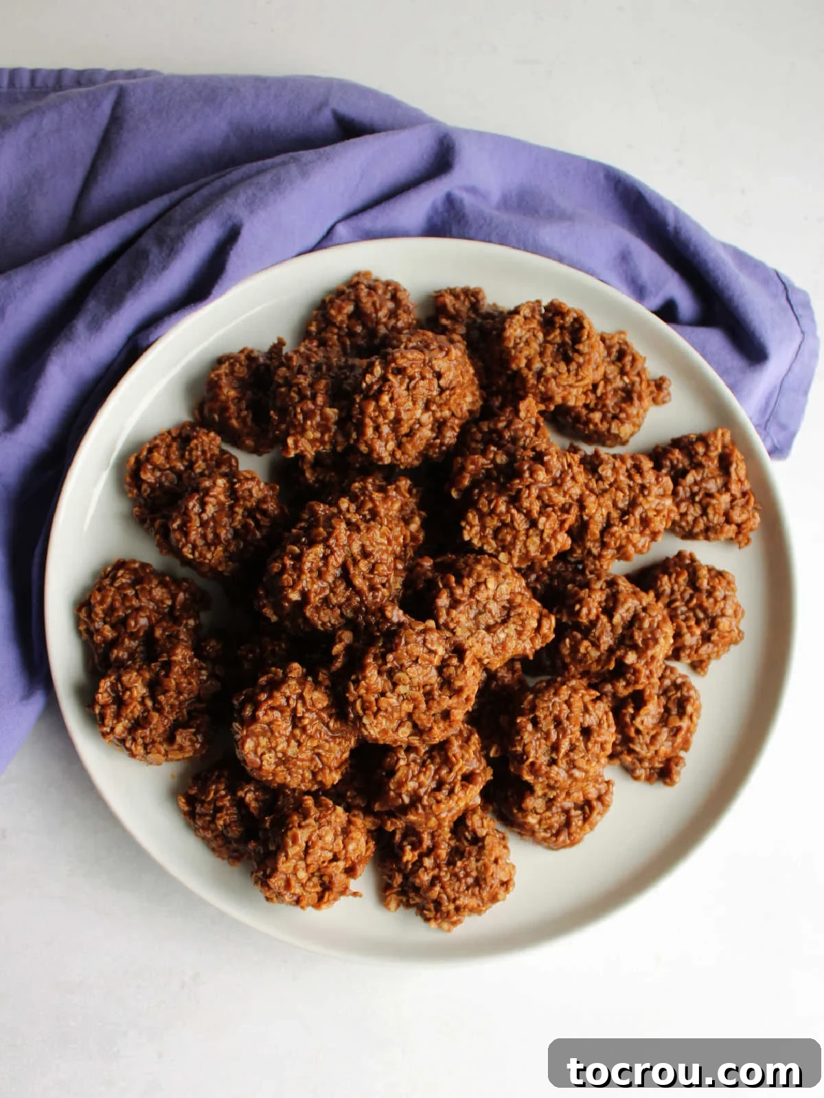 Chocolate Peanut Butter No-Bake Oatmeal Delights 7 Pile of peanut butter chocolate no bake cookies with oatmeal.