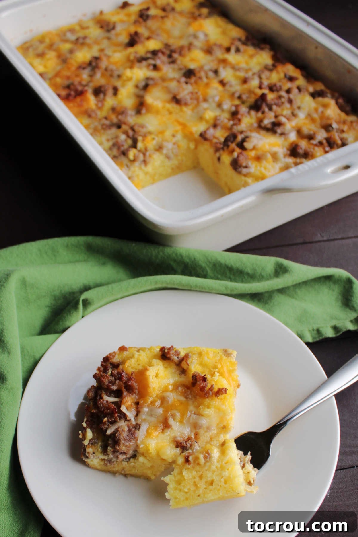 Savory Sausage Cornbread Morning Bake 5 Bite of cornbread and egg breakfast casserole on fork, ready to be eaten.