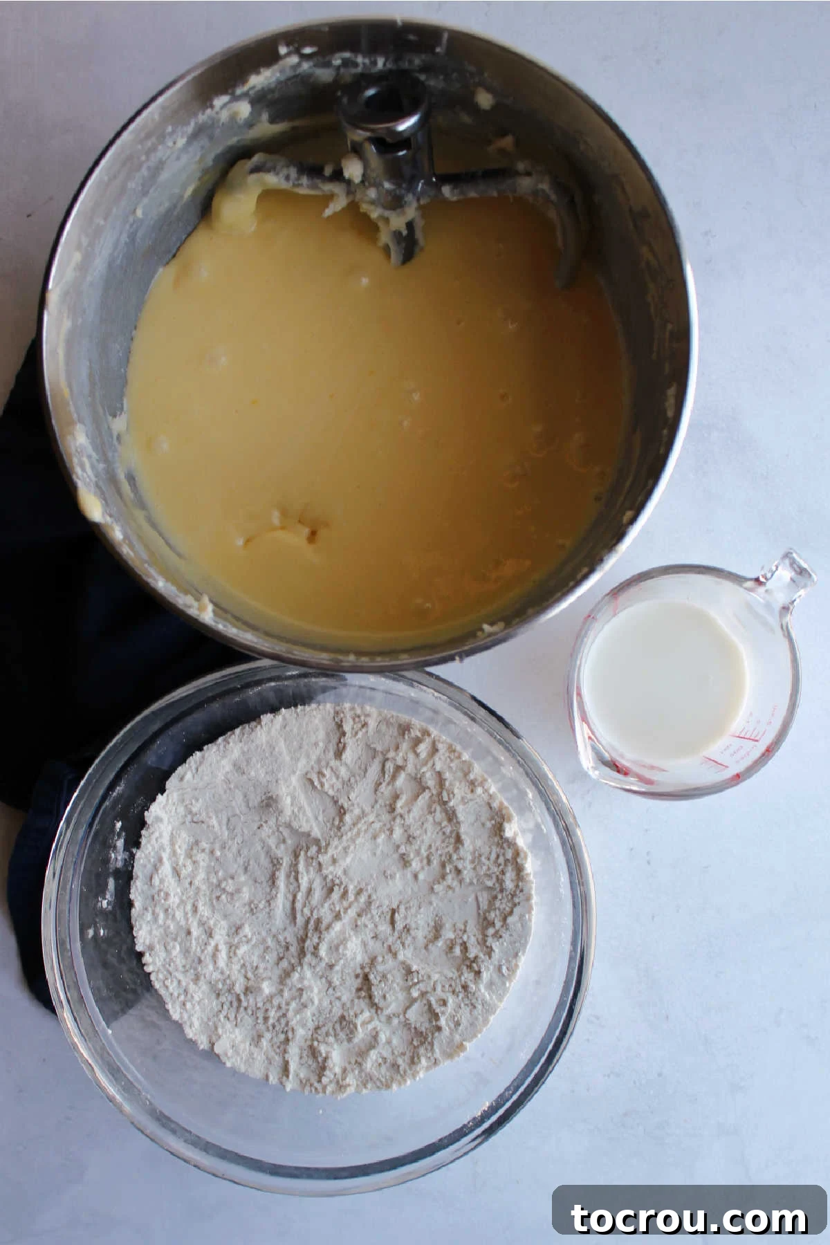 Wet and dry ingredients ready to be made into petit four cake batter. 