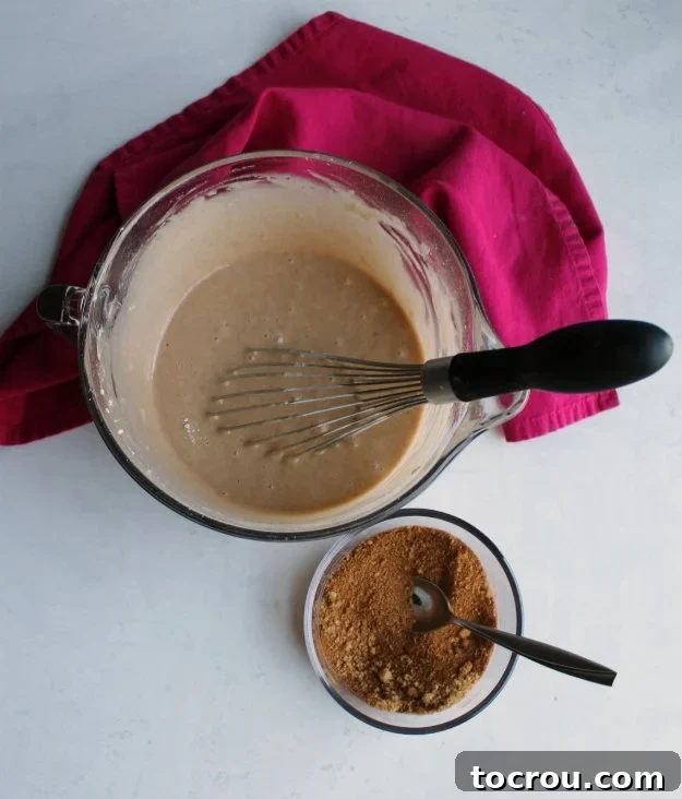 Prepare the delightful cinnamon sugar mixture and the smooth, airy bread batter for your quick bread. mixing bowl of cinnamon bread batter and small bowl of cinnamon sugar sprinkle mixture.