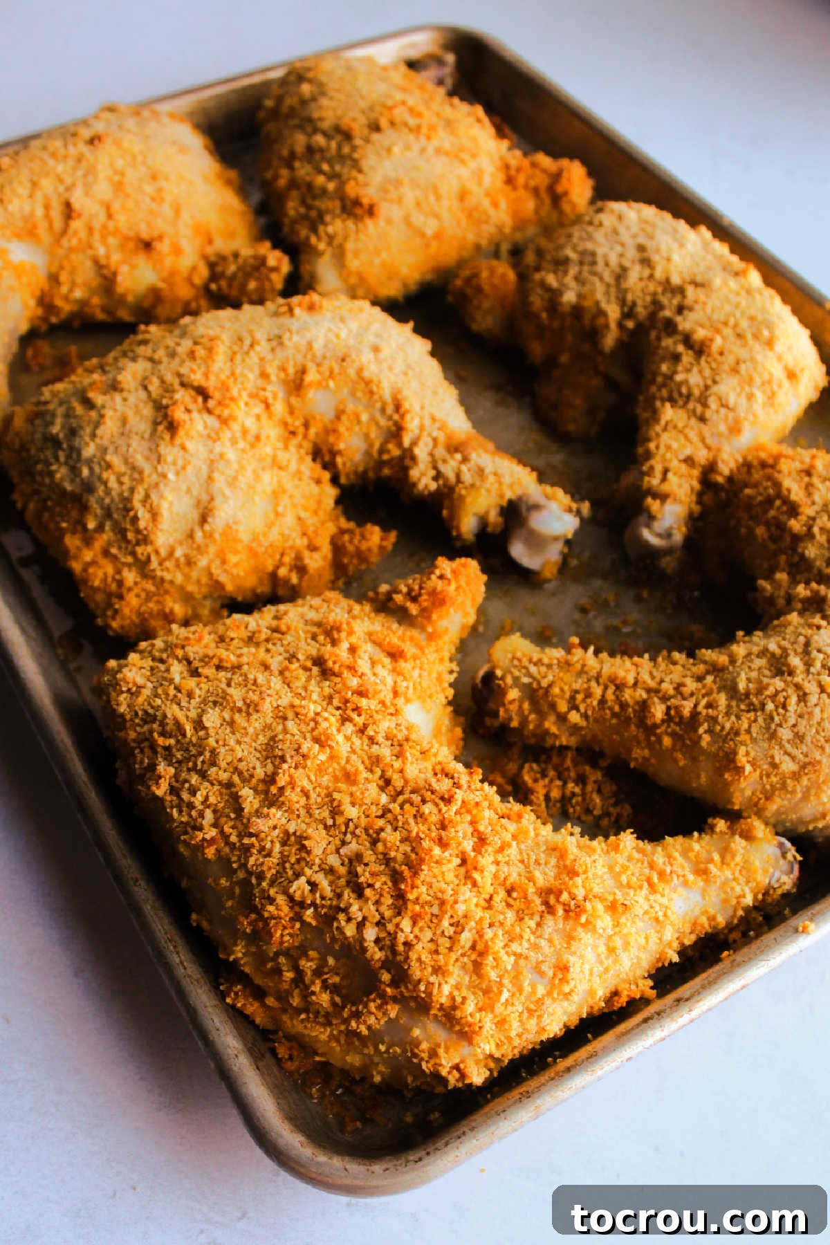 Tray of cornflake crumb coated chicken fresh from the oven. 