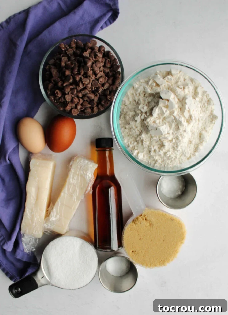 Cookie Ingredients Ready Lard, flour, chocolate chips, brown sugar, granulated sugar, and eggs, laid out as ingredients for cookie dough.