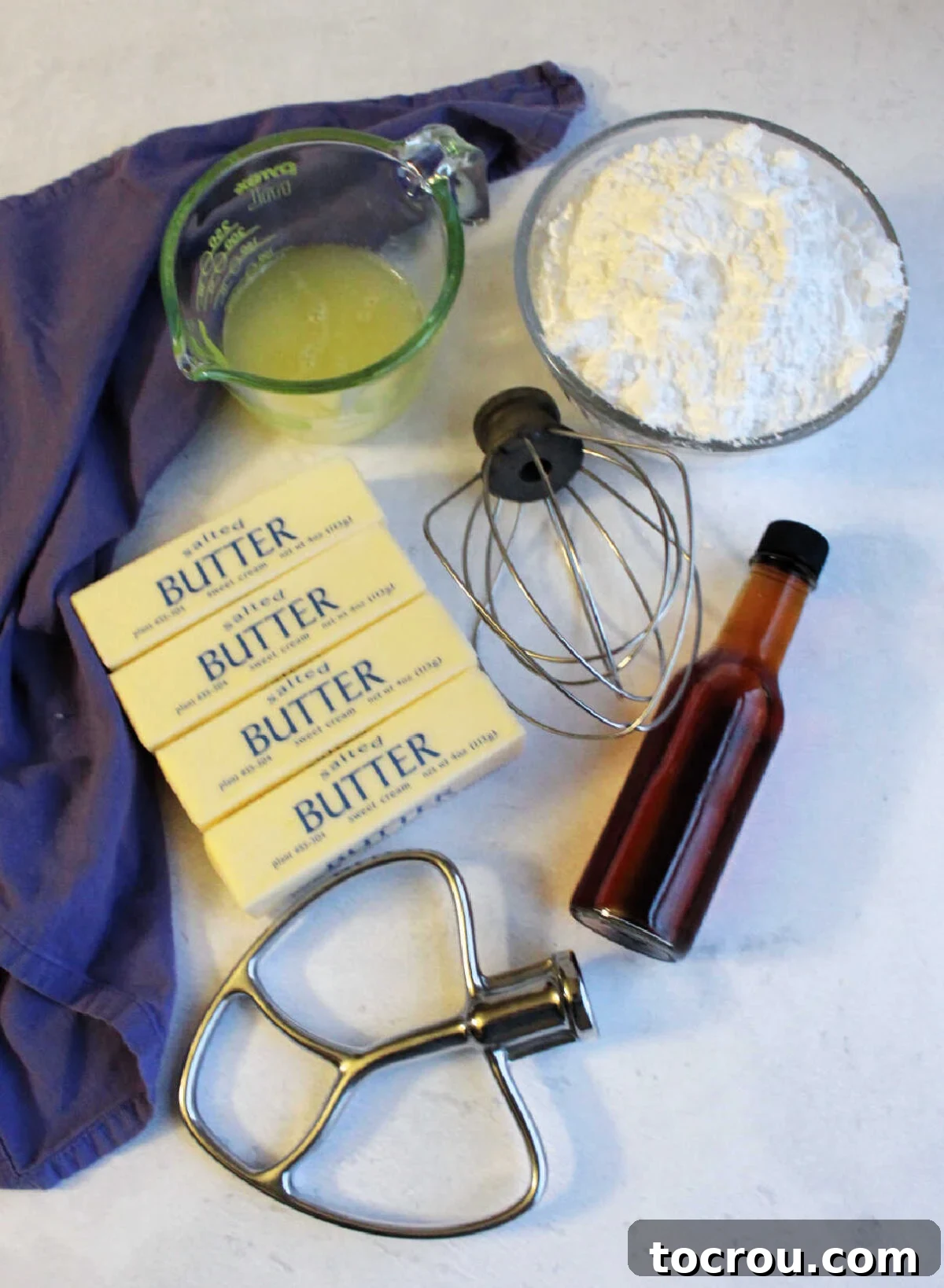 Butter, pasteurized egg whites, powdered sugar and vanilla ready to be made into buttercream.