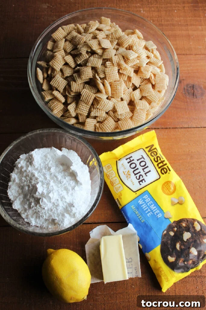 Ingredients laid out: Chex cereal, powdered sugar, butter, fresh lemons, and white baking chips, ready for making lemon muddy buddies.