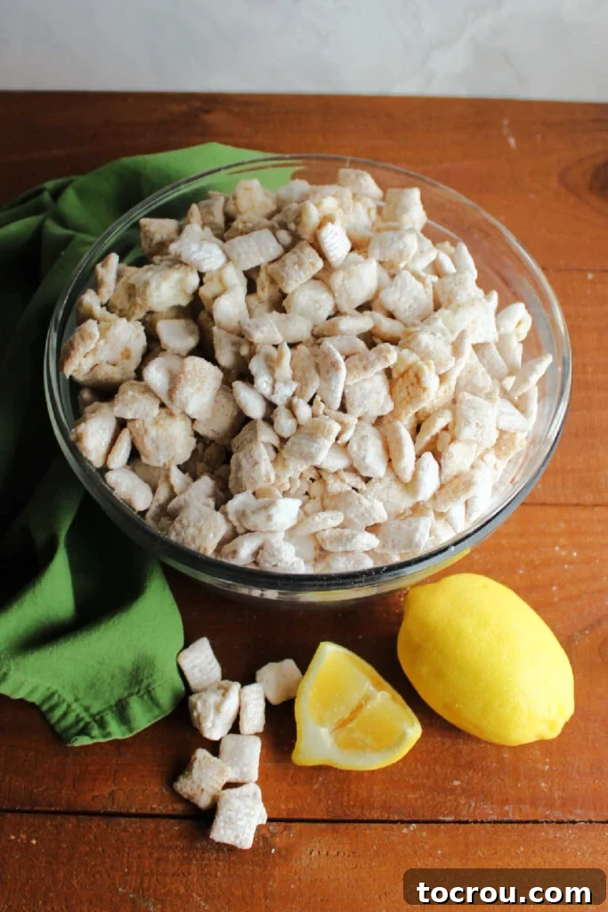 A vibrant serving bowl overflowing with homemade lemon cereal snack mix, ready to be enjoyed.