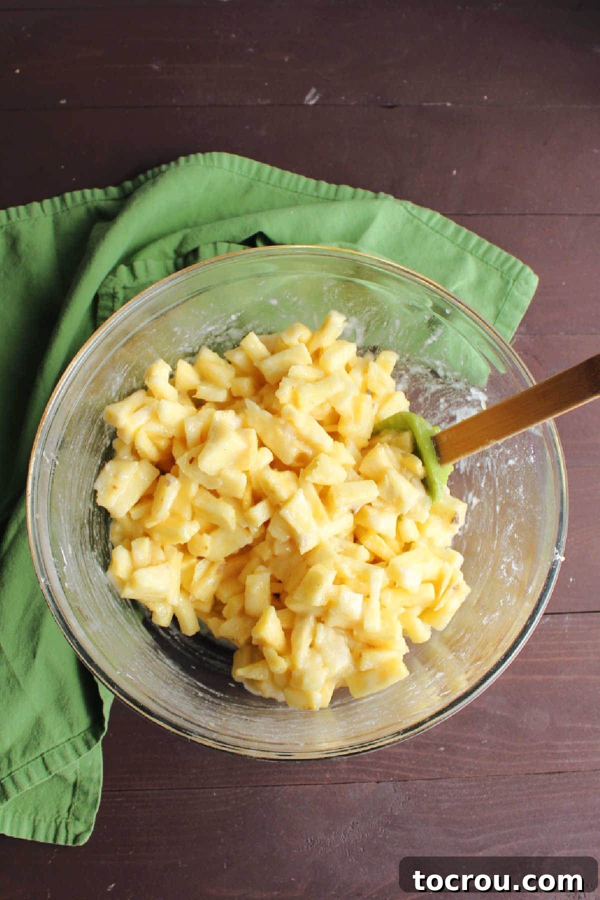 Chunks of pineapple coated with sugar and flour.