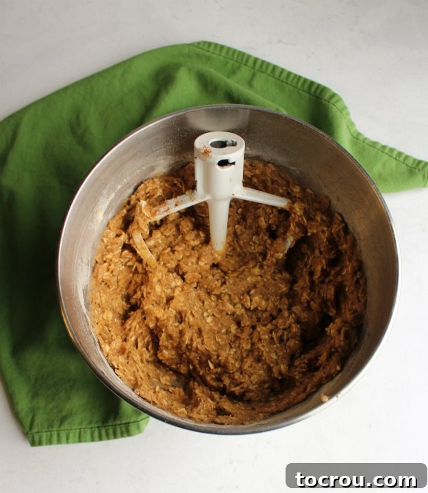 Whole Grain Cookie Dough Mixer bowl filled with creamy whole grain banana bread cookie dough, ready for baking.