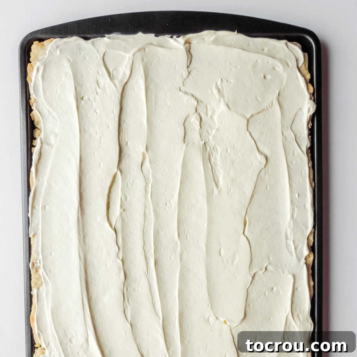 Stars and Stripes Cookie Squares 11 Some of the frosting spread over cooled cookie bars.