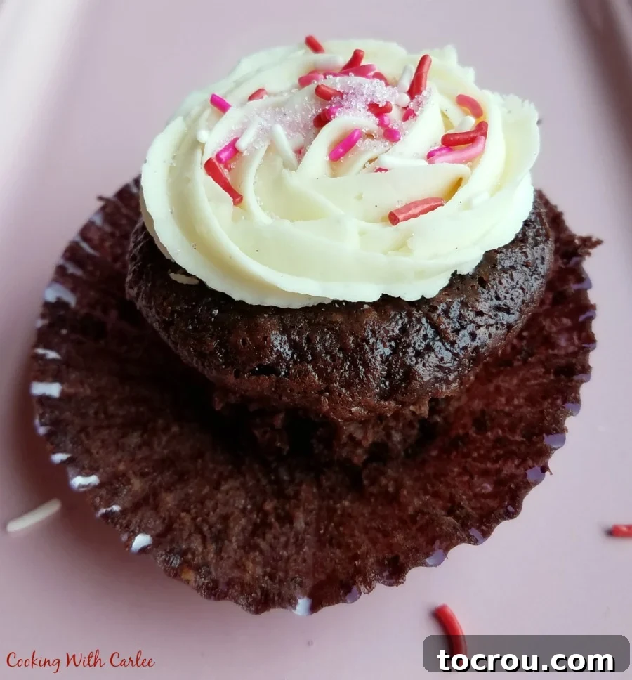 Decadent Chocolate Banana Cupcakes 3 wrapper pulled down exposing moist chocolate banana cupcake.