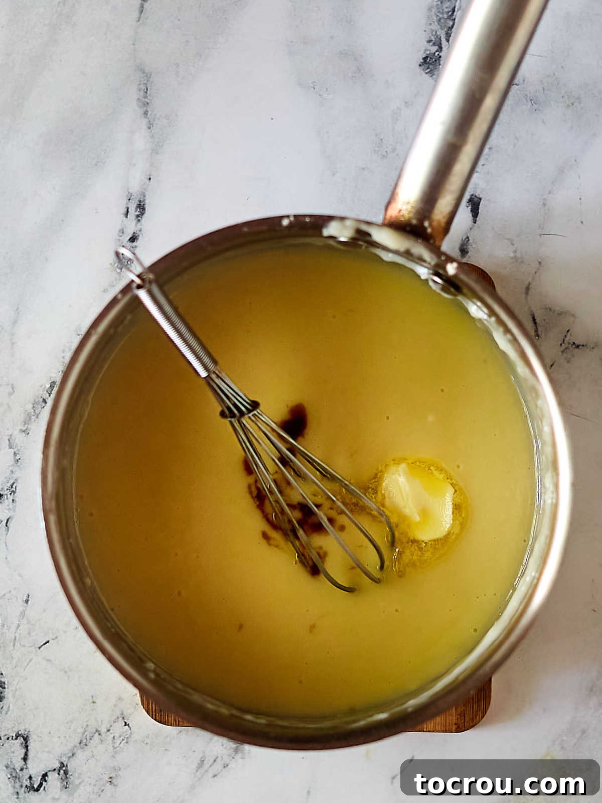 Saucepan filled with pudding mixture, ready to stir in vanilla and butter. 