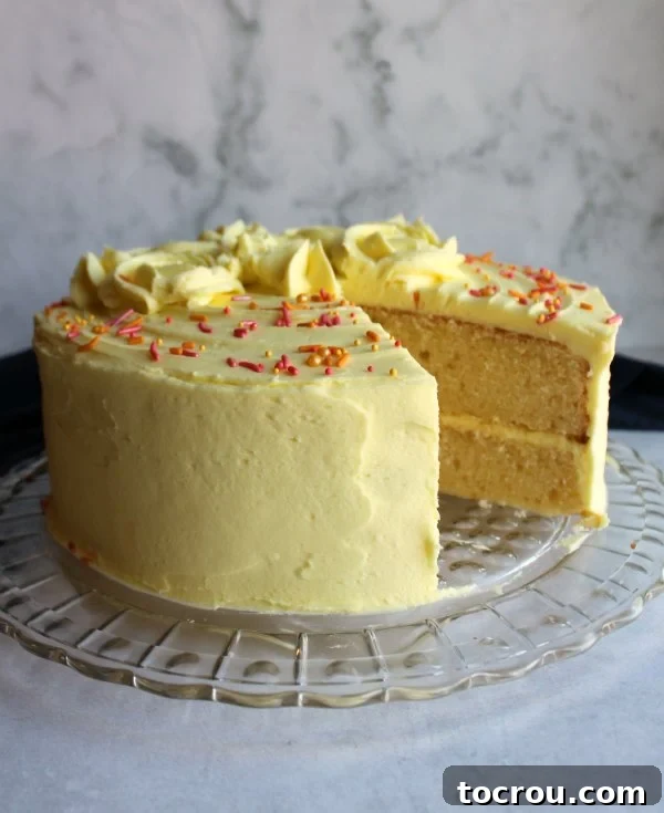 round lemon velvet cake with slice missing