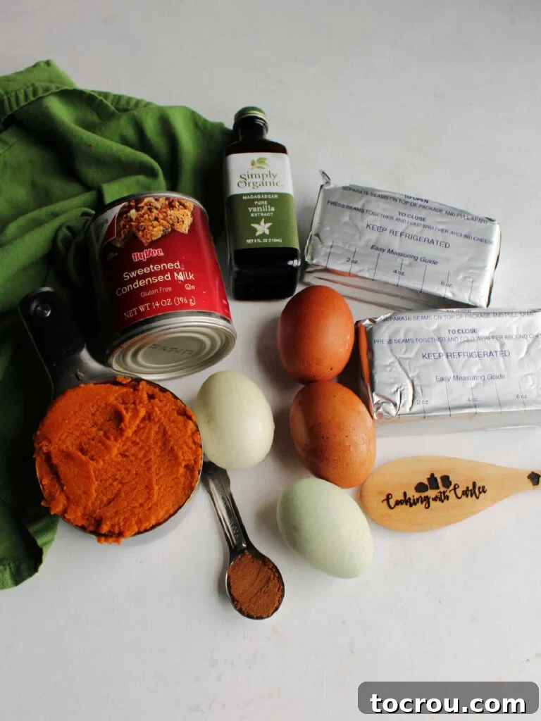 Decadent Pumpkin Cheesecake 4 Ingredients for pumpkin cheesecake filling including cream cheese, eggs, pumpkin, condensed milk, pumpkin pie spice and vanilla.