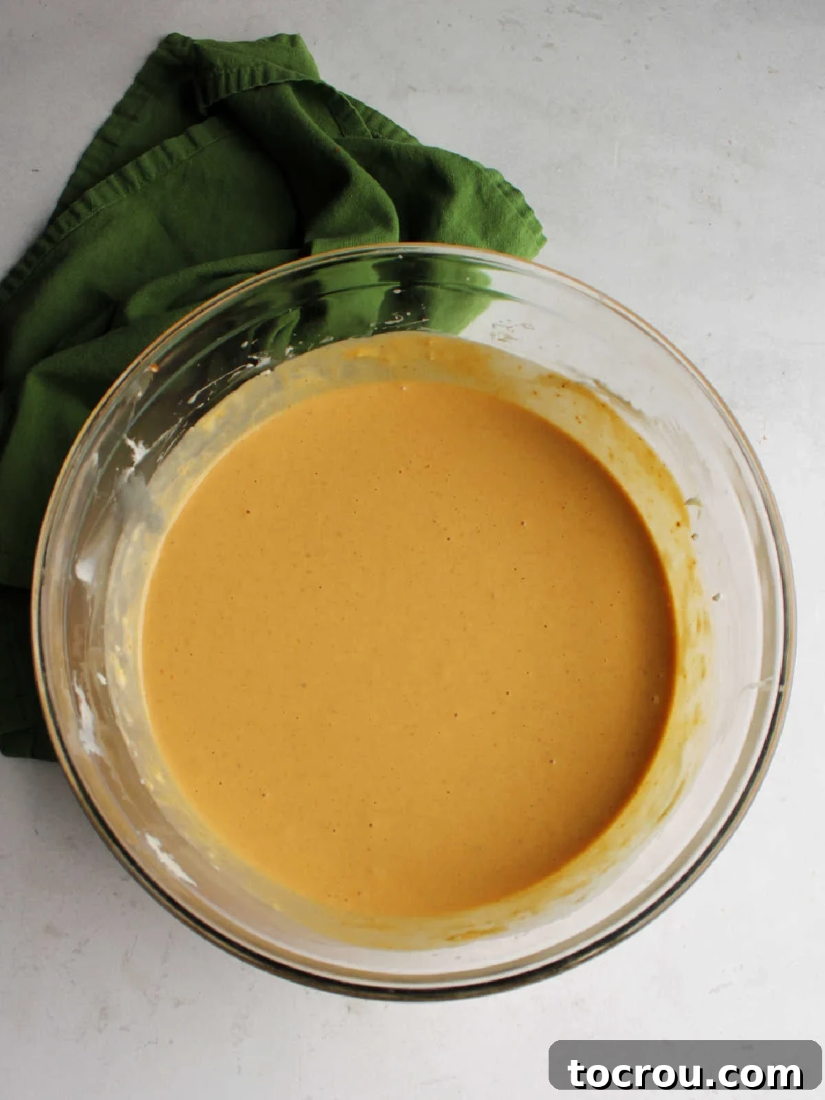 Decadent Pumpkin Cheesecake 6 Mixing bowl filled with pumpkin cheesecake mixture.