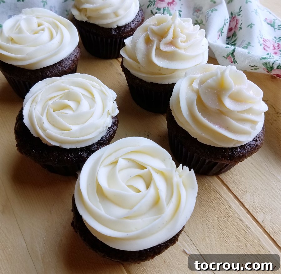 Adding a little cupcakes with swirls of white sweetened condensed milk frosting piped on top.
